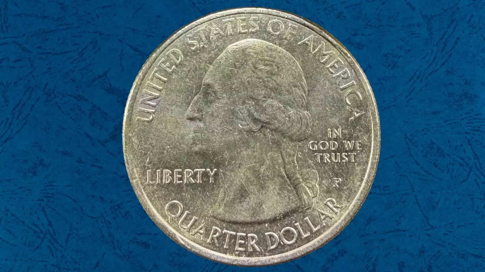 2016 quarter off-center strike error showing design shifted from center with blank planchet crescent visible